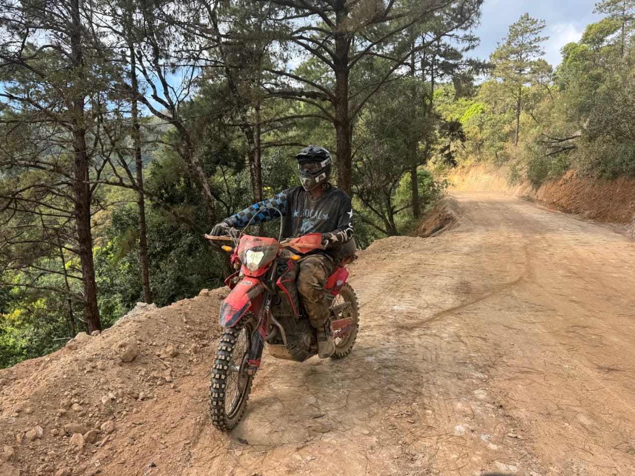 Enduro rider on a rooted jungle single track in Northern Thailand