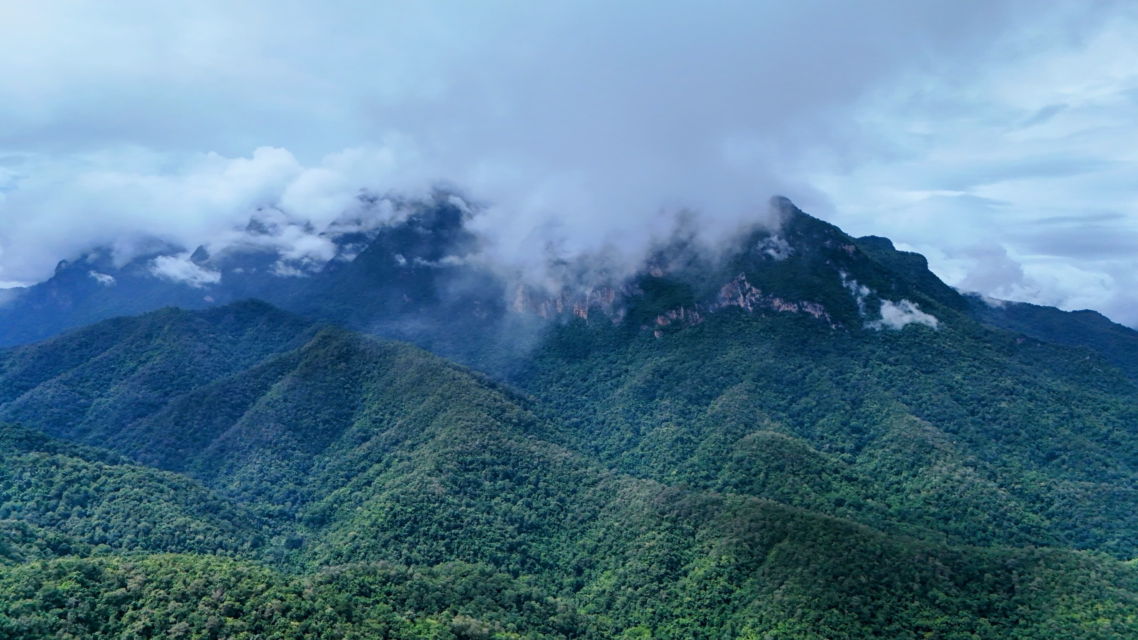 The limestone massif of Doi Luang Chiang Dao under low cloud at the end of day one